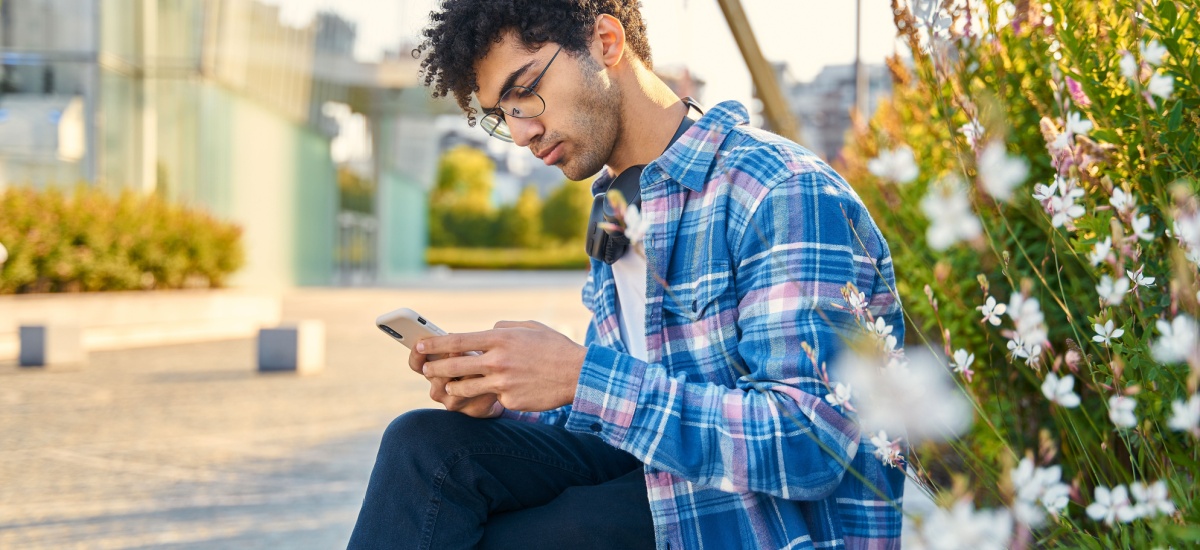 man-on-phone-outside-sunny
