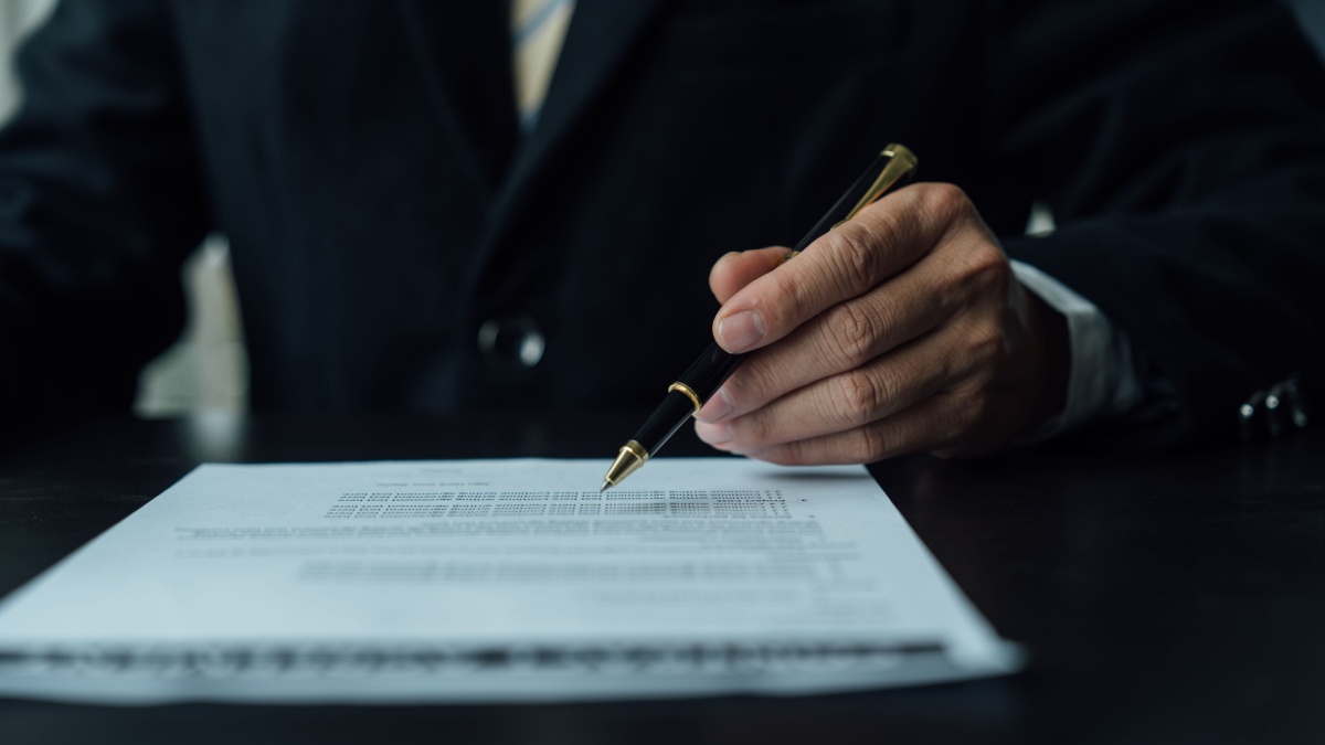 man-documents-signing