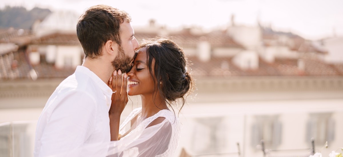 Close up of a newly wedded couple kissing