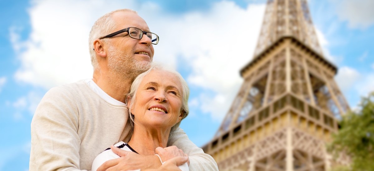 Elderly retiree couple hugging in Paris